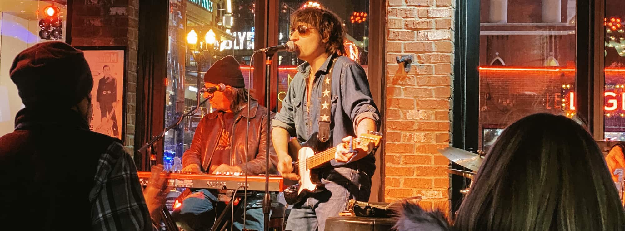 bar singer on guitar in Colorado Springs