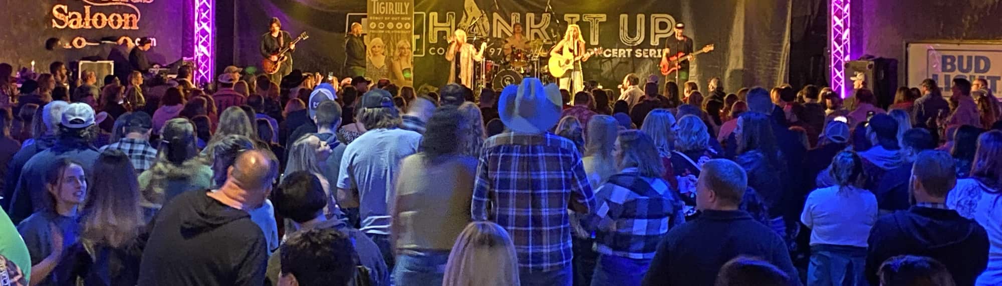 country concert with fans wearing cowboy hats Colorado Springs