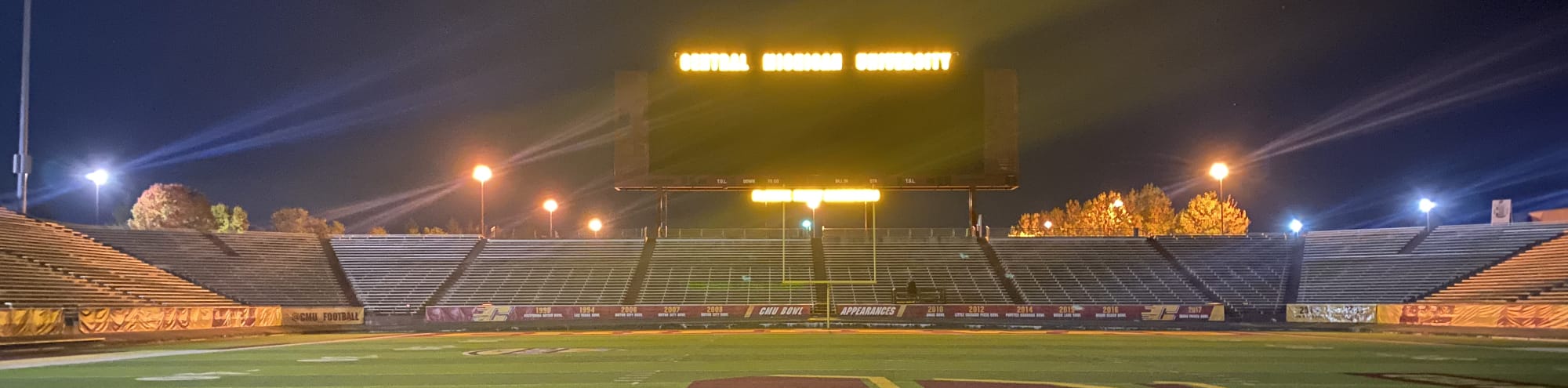 empty football stadium at night under the lights Colorado Springs